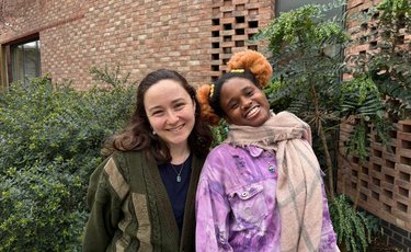 Jess and Rica are smiling at the camera